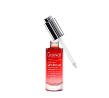 Load image into Gallery viewer, An open bottle of Guinot Life Influx Concentrate, a regenerating anti-aging serum in a red pump bottle with silver lid