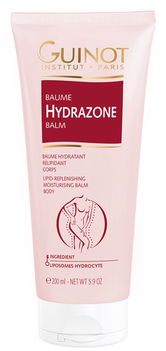 A tube of GUINOT Hydrazone Balm with pink and white packaging, highlighting its benefits for sensitive skin, collagen, elastin, hyaluronic acid, vitamin E, and magnesium.